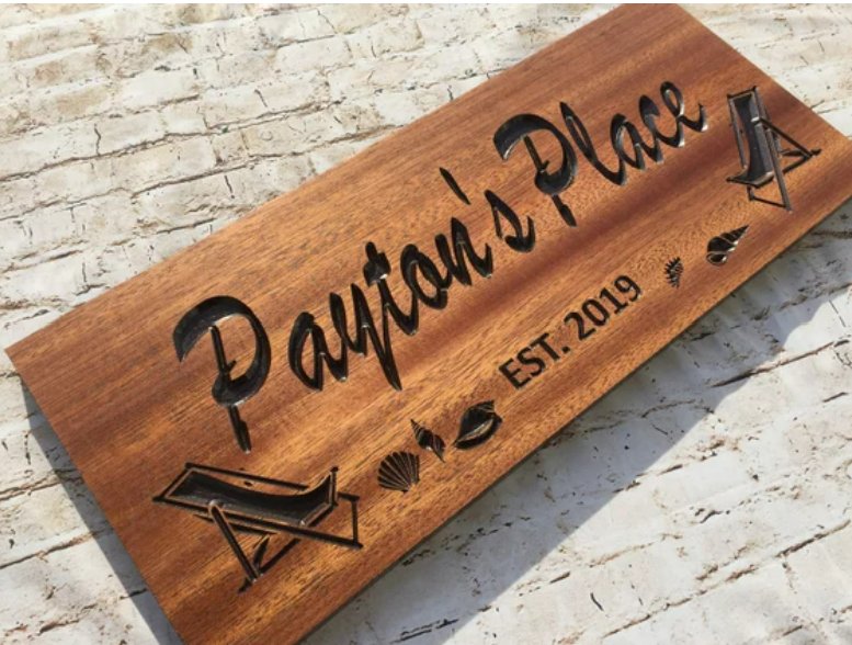 Custom laser engraving on cedar wood close-up